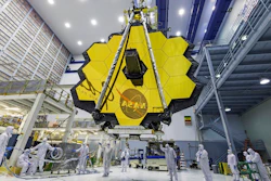 In this April 13, 2017 photo provided by NASA, technicians lift the mirror of the James Webb Space Telescope using a crane at the Goddard Space Flight Center in Greenbelt, Md. The telescope’s 18-segmented gold mirror is specially designed to capture infrared light from the first galaxies that formed in the early universe. On Tuesday, March 27, 2018, NASA announced it has delayed the launch of the next-generation space telescope until 2020.