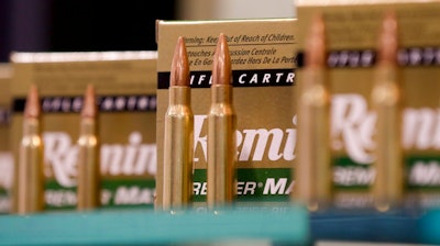 In this Tuesday, Jan. 15, 2013 file photo, Remington rifle cartridges are displayed at the 35th annual SHOT Show in Las Vegas. U.S. gun maker Remington Outdoor Company has filed for bankruptcy protection after months of financial problems, falling sales and lawsuits tied to the Sandy Hook Elementary School massacre. Records from the bankruptcy court of the district of Delaware show that the company filed late Sunday, March 25, 2018.