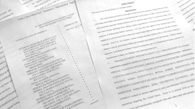 In this March 15, 2018, photo, a portion of the Feb. 16, indictment against Russia's Internet Research Agency is photographed in Washington. In its toughest challenge to Russia to date, the Trump administration accused Moscow of an elaborate plot to penetrate America’s electric grid, factories, water supply and even air travel through cyber hacking.