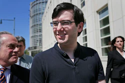 In this Aug. 4, 2017 file photo, Martin Shkreli, center, leaves federal court in New York. A judge has ruled that 'Pharma Bro' Martin Shkreli was responsible for nearly $10.5 million in losses in his securities fraud case. The amount set on Monday by Judge Kiyo Matsumoto could result in a harsher punishment for Shkreli at his March 9 sentencing.