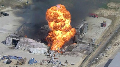 In this image from video by KDFW, a fire burns at the Tri-Chem Industries plan in Cresson, Texas. Officials said fears of another blast amid the toxic chemicals prevented crews from battling the blaze.