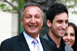 In this April 21, 2011 file photo shows MGA chief executive Isaac Larian, left, leaves federal court in Santa Ana, Calif., after a victory over Mattel Inc. The CEO of the maker of the pouty Bratz dolls is launching a campaign to salvage some of Toys R Us' U.S. business being liquidated in bankruptcy.