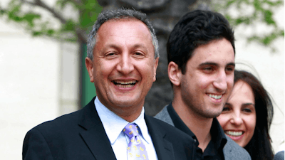 In this April 21, 2011 file photo shows MGA chief executive Isaac Larian, left, leaves federal court in Santa Ana, Calif., after a victory over Mattel Inc. The CEO of the maker of the pouty Bratz dolls is launching a campaign to salvage some of Toys R Us' U.S. business being liquidated in bankruptcy.