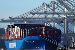 In this Jan. 30, 2018, file photo, a container ship waits to be unloaded at the Port of Oakland in Oakland, Calif. The Commerce Department reports on the U.S. trade gap for January, on Wednesday, March 7.
