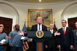President Donald Trump, center, speaks in the Roosevelt Room of the White House in Washington, Thursday, March 8, 2018, before signing two proclamations, one on steel imports and one on aluminum imports. Standing with Trump are workers, left, Vice President Mike Pence, Treasury Secretary Steven Mnuchin and Commerce Secretary Wilbur Ross.