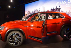 Journalists look at Volkswagen's five-passenger SUV concept at the New York Auto Show, Tuesday, March 27, 2018. The vehicle will be designed and engineered for the American market and Volkswagen will construct it at its plant in Chattanooga, Tenn.
