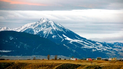 This Nov. 21, 2016, file photo shows Emigrant Peak towering over the Paradise Valley in Montana north of Yellowstone National Park, the day U.S. officials announced a ban on new mining claims across more than 30,000 acres in the area. U.S. government officials are moving forward with a plan to block new gold mining claims for 20 years on more than 30,000 acres of public lands north of Yellowstone National Park. The U.S. Forest Service released a draft environmental assessment on Thursday, March 29, 2018, for the proposed withdrawal of lands in the Absaroka mountains from new claims for gold and other 'locatable' minerals, such as silver, platinum and uranium.