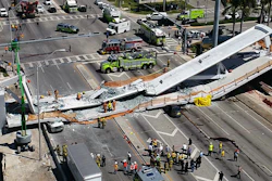 This photo provided by DroneBase shows the collapsed pedestrian bridge at Florida International University in the Miami area on Thursday, March 15, 2018.