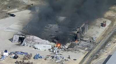 In this image from video by KDFW, a fire burns at the Tri-Chem Industries plan in Cresson, Texas. Officials said fears of another blast amid the toxic chemicals prevented crews from battling the blaze.