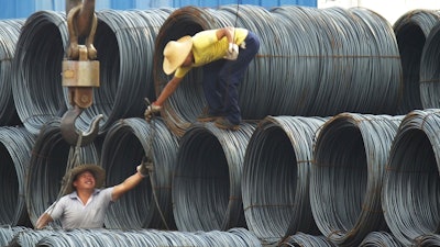 In this Aug. 1, 2016 photo, laborers work in the steel market in Yichang in central China's Hubei province. China has expressed “grave concern” about a U.S. trade policy report that pledges to pressure Beijing but had no immediate response to President Donald Trump’s plan to hike tariffs on steel and aluminum. The Commerce Ministry said Friday, March 2, 2018, that Beijing has satisfied its trade obligations and appealed to Washington to settle disputes through negotiation.