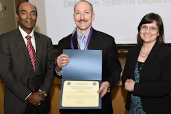 Mary Miller, right, performing the duties of assistant secretary of defense for research and engineering, and Dr. Jagadeesh Pamulapati, left, director, laboratories office, office of the assistant secretary of defense for research and engineering, present the Department of Defense STEM Advocate of the Quarter Award to Dr. John DiCecco from the Naval Undersea Warfare Center Division Newport, during the 2018 Engineers Week celebration held at the Pentagon Library and Conference Center.