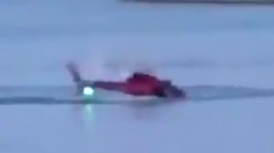 A still from amateur video of the helicopter as it went down in New York City.
