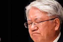 Kobe Steel President and CEO Hiroya Kawasaki reacts as he listens to a reporter's question during a press conference in Tokyo, Tuesday, March 6, 2018. Kawasaki is stepping down over a scandal that surfaced last year involving massive falsification of inspections data of the company’s products.