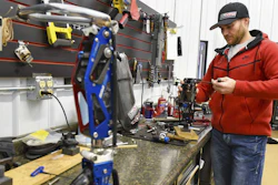 In this Dec. 22, 2017 photo, Mike Schultz works on a performance prosthetic for an athlete in his shop in St. Cloud, MN.