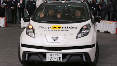In this Feb. 23, 2018, file photo, Nissan Motor Co.'s Easy Ride robo-vehicle moves during a test ride in Yokohama, near Tokyo. Nissan's chief planning officer said Friday the Japanese automaker does not plan to change its road tests for self-driving vehicles after the recent fatal accident of an Uber autonomous vehicle.