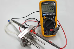 This is the RMIT-developed proton battery connected to a voltmeter. The working prototype has an energy per unit mass already comparable with commercially-available lithium ion batteries.
