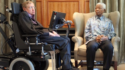 In this Thursday, May 15, 2008 file photo former South African President Nelson Mandela, right, meets with British scientist Professor Stephen Hawking, left, in Johannesburg. Hawking, whose brilliant mind ranged across time and space though his body was paralyzed by disease, has died, a family spokesman said early Wednesday, March 14, 2018.
