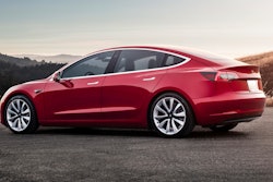 This undated photo provided by Tesla shows the Tesla Model 3, which delivers a sporty ride with a premium feel. The Model 3 is dramatically quicker and more engaging to drive than other popular EVs such as the BMW i3 and the Chevrolet Bolt.