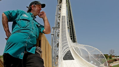 In this July 9, 2014, file photo, ride designer Jeffery Henry looks over his creation, the world's tallest waterslide called 'Verruckt' at Schlitterbahn Waterpark in Kansas City, Kan. The Kansas City Star reports that Schlitterbahn Waterparks and Resorts co-owner Henry was arrested Monday, March 26, 2018, in Cameron County, Texas.