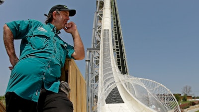In this July 9, 2014, file photo, ride designer Jeffery Henry looks over his creation, the world's tallest waterslide called 'Verruckt' at Schlitterbahn Waterpark in Kansas City, Kan. The Kansas City Star reports that Schlitterbahn Waterparks and Resorts co-owner Henry was arrested Monday, March 26, 2018, in Cameron County, Texas.