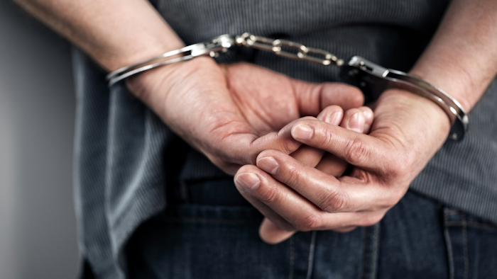 Closeup Of Cuffed Criminal Hands 000059885946 Small