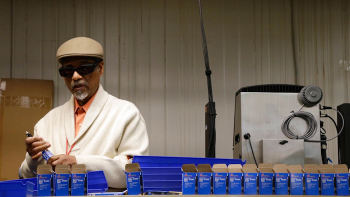 n this April 16, 2018, photo, employee Clifford Alexander Sr. boxes SKILCRAFT pens for the U.S. Government at the Industries of the Blind in Greensboro, N.C. The ubiquitous SKILCRAFT U.S. Government pens turning 50 this month. National Industries for the Blind traces the pen’s history to April 20, 1968, when it was introduced to government buyers.