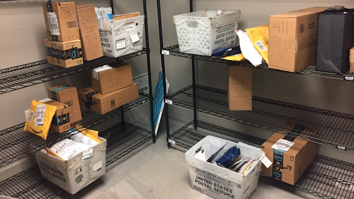 Packages from Internet retailers are delivered with the U.S. Mail in a apartment building mail room in Washington.