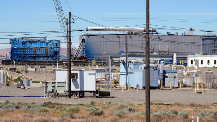 This May 13, 2017, photo shows a portion of the Plutonium Finishing Plant on the Hanford Nuclear Reservation near Richland, Wash. Officials say dozens of workers demolishing the 1940s-era plutonium processing plant there have ingested or inhaled radioactive particles in the past year, prompting a halt to the demolition of the plant until a safe plan can be developed.