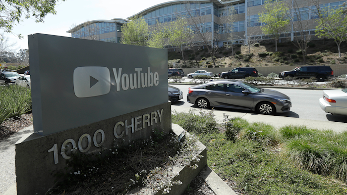 A YouTube sign is shown across the street from the company's offices in San Bruno, Calif., Tuesday, April 3, 2018. A woman opened fire at YouTube headquarters Tuesday, setting off a panic among employees and wounding several people before fatally shooting herself, police and witnesses said.