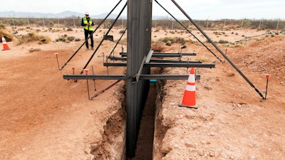 This April 6, 2018 photo provided by U.S. Customs and Border Protection shows a new type of bollard wall that will replace existing wire mesh and vehicle barriers near the Santa Teresa, N.M., port of entry. The new wall being constructed along a 20-mile (32-kilometer) stretch of the U.S.-Mexico border in southern New Mexico as part of President Donald Trump's fight against drug trafficking and illegal immigration is being advertised as a 'very serious structure' made of metal and concrete. Officials gathered Monday, April 9, 2018 to mark the groundbreaking of the $73 million project at Santa Teresa.