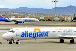 In this May 9, 2013, file photo, two Allegiant Air jets taxi at McCarran International Airport in Las Vegas. Shares of Allegiant Air’s parent company are tumbling in Monday, April 16, 2018, premarket trading following a “60 Minutes” investigation that expressed serious safety concerns about the airline.