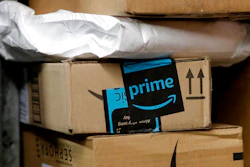 In this May 9, 2017, file photo, a package from Amazon Prime is loaded for delivery in New York. Last year, the online retailer introduced a system for letting people delivering packages into customers’ homes. Now, it’s their cars. GM says more than 7 million owners of Chevrolet, Buick, GMC and Cadillac vehicles are eligible for Amazon’s new Amazon Key In-car delivery service.