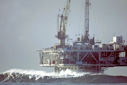 In this file photo, waves break by an oil platform that's offshore from Seal Beach, California.