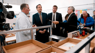 In this 2003 file photo CanadaDrugs.com Director of Pharmacy Robert Fraser, left, takes Minnesota Gov. Tim Pawlenty, second left, on a tour of the Internet pharmacy