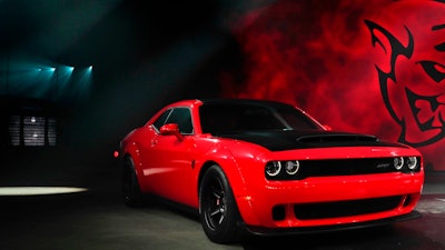 This April 11, 2017, file photo shows the 2018 Dodge Challenger SRT Demon during a media preview for the New York International Auto Show in New York. This limited-edition variant boasts a maximum 840 horsepower and various modifications to improve straight-line acceleration.