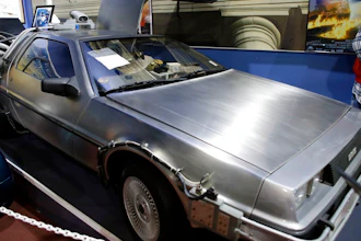 This Tuesday, Dec. 24, 2013, file photo shows a 1981 DeLorean DMC-12 sports car decorated to resemble the vehicles used to portray a time machine in the 'Back to the Future' movie franchise, shown in a display about the movies at the Miami Auto Museum at the Dezer Collection in North Miami, Fla. Sally DeLorean, the widow of maverick automaker John DeLorean, filed a federal lawsuit in New Jersey on Monday, April 23, 2018, alleging the DeLorean Motor Company in Humble, Texas – not affiliated with the automaker founded by John DeLorean that went bankrupt in 1982 – isn't entitled to money that the lawsuit says the Texas company received from Universal Pictures, the studio that distributed and helped produce the movies.
