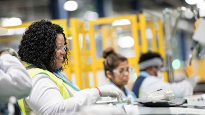 In this March 16, 2018, photo, Elbony Jeter works on the factory floor at the Samsung washing machine facility, in Newberry, S.C. The South Korean manufacturer moved into the former Caterpillar facility location in 2017. On Monday, April 2, 2018, The Institute for Supply Management, a trade group of purchasing managers, issues its index of manufacturing activity for March.