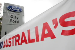 In this May 23, 2013 file photo, a banner is displayed at a Ford dealership in Sydney. Ford Motor Co.’s Australian subsidiary was fined 10 million Australian dollars ($7.6 million) by an Australian court on Thursday, April 26, 2018, for mishandling customer complaints about faulty automatic transmissions in thousands of cars.