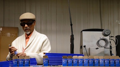 n this April 16, 2018, photo, employee Clifford Alexander Sr. boxes SKILCRAFT pens for the U.S. Government at the Industries of the Blind in Greensboro, N.C. The ubiquitous SKILCRAFT U.S. Government pens turning 50 this month. National Industries for the Blind traces the pen’s history to April 20, 1968, when it was introduced to government buyers.