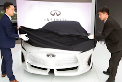 n this April 19, 2018, photo, workers remove the veil from the Infiniti electric concept sedan at a showroom ahead of the Auto China 2018 to be held in Beijing, China. Auto China 2018, the biggest global auto show of the year, showcases China's ambitions to become a leader in electric cars and the industry's multibillion-dollar scramble to roll out models that appeal to price-conscious but demanding Chinese drivers.
