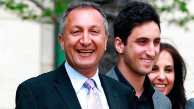 In this April 21, 2011 file photo shows MGA chief executive Isaac Larian, left, leaves federal court in Santa Ana, Calif., after a victory over Mattel Inc. A campaign led by the billionaire toy executive who pledged $200 million with other investors in hopes of saving part of the bankrupt chain has foundered, with only $59,000 more raised from fewer than 2,000 people in three weeks.