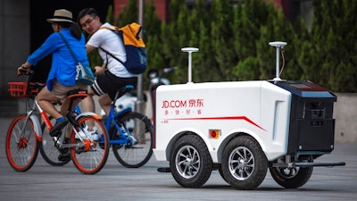 This undated image provided by JD.com shows an autonomous delivery vehicle. Dr. Hui Cheng, the head of robotics research at JD.’s Silicon Valley Research Center, recently spoke with The Associated Press about the priorities of the lab, the “spoiled” Chinese consumer and the prospect of talking robots. Under Cheng, who previously worked on Amazon Go’s cashier-less store project, JD is working on areas like artificial intelligence.