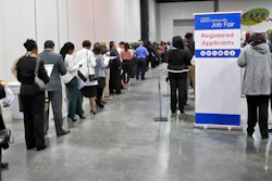 In this March 27, 2018, photo, applicants line up for the opening of the job fair, held by Hartsfield Jackson Airport in Atlanta. The job fair featured more than 60 of the Airport community's top employers. On Wednesday, April 4, 2018, payroll processor ADP reports how many jobs private employers added in March.
