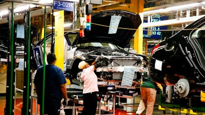 n this Feb. 14, 2017, file photo, employees do assembly and quality control work on automobiles at the Mercedes-Benz plant in Tuscaloosa, Ala. If a trade spat between the U.S. and China escalates and both countries raise tariffs, American automakers won’t suffer that much. But German luxury automakers BMW and Mercedes will. Mercedes ships up to 75,000 more from Tuscaloosa County.