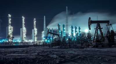 Oil Rigs And Brightly Lit Industrial Site At Night 510477582 4256x2832