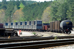 This April 12, 2018 photo shows containers that were loaded with tons of sewage sludge in Parrish, Ala. More than two months after the so-called 'Poop Train' rolled in from New York City, Hall says her small town smells like rotting corpses. Some say the trainloads of New Yorkers' excrement is turning Alabama into a dumping ground for other states' waste.