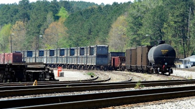 This April 12, 2018 photo shows containers that were loaded with tons of sewage sludge in Parrish, Ala. More than two months after the so-called 'Poop Train' rolled in from New York City, Hall says her small town smells like rotting corpses. Some say the trainloads of New Yorkers' excrement is turning Alabama into a dumping ground for other states' waste.