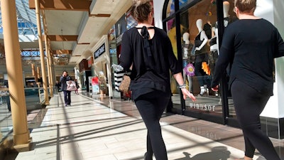 In this April 9, 2018, file photo, shoppers walk in a mall in Salem, N.H. On Monday, April 16, the Commerce Department releases U.S. retail sales data for March.