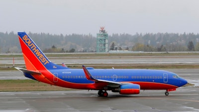 In this April 13, 2018, photo, a Southwest Airlines plane taxis at the Seattle-Tacoma International Airport in Seattle. Southwest Airlines Co. reports earns on Thursday, April 26, 2018.