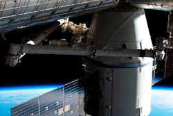 1 0 In this image provided by NASA, the Dragon capsule arrives at the International Space Station on Wednesday, April 4, 2018 with food and experiments. It will remain attached to the orbiting outpost for about a month, returning to Earth in May. Dragon launched Monday from Cape Canaveral, Florida, aboard a used Falcon rocket. SpaceX wants to reduce launch costs by recycling rocket parts.